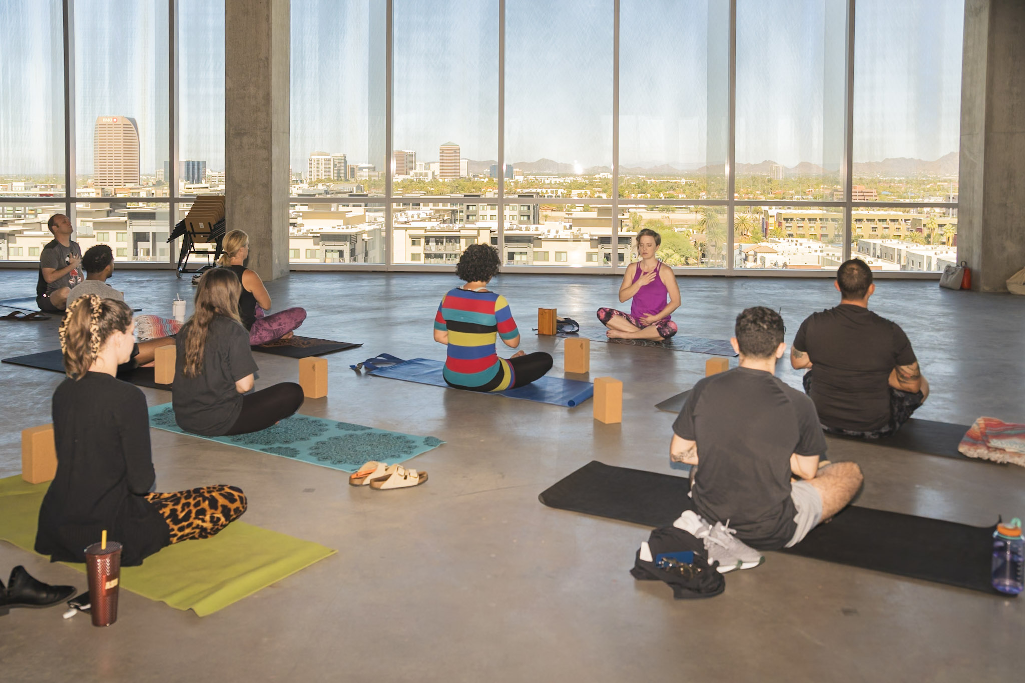 Teresa Porter leading a workplace wellness session in a city office
